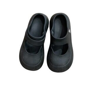 Black Mary Jane-style slip-on shoes